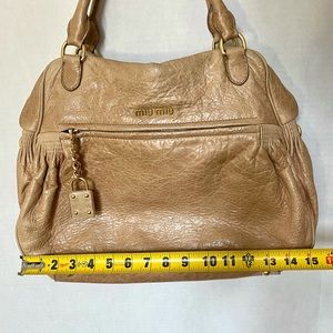 Authentic Miu Miu Leather Tan Beige Purse faux lock. adjustable shoulder strap